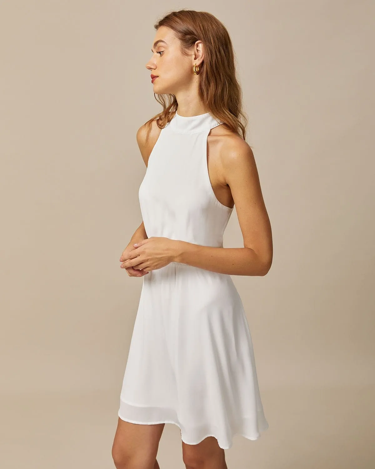 The White Mock Neck Pearls Backless Mini Dress